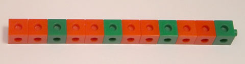 A line of coloured cubes consisting of two red cubes and a green cube repeated four times.