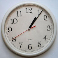An analogue clock with clearly labelled numerals.