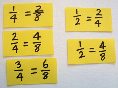 Cards marked with equivalent fractions.