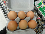 Six eggs in a carton arranged in a 2 by 3 array.