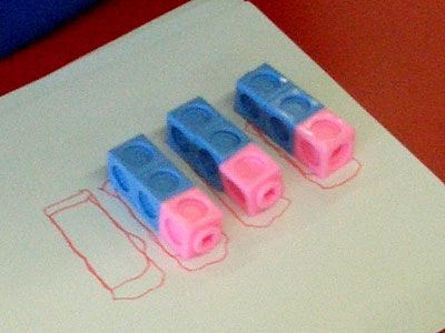 Three groups of blue-blue-pink cubes in the same orientation.