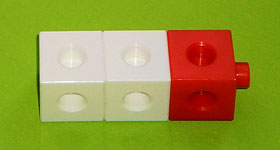Three adjoining cubes: two white followed by one red.