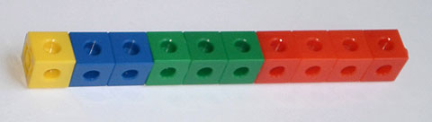 A line of cubes consisting of one yellow, two blue, three green and four red cubes.