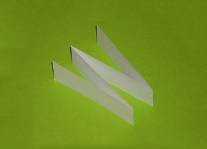 Photo of a paper strip folded into a W shape.
